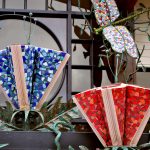 Close up Detail of Dragonfly and Book Flower Sculpture